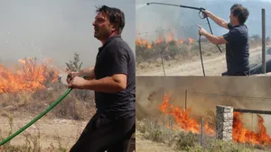 Damian de Santo combate un incendio cercano a sus cabañas en La Cumbre