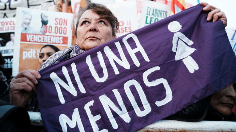 A demonstrator holds a piece of fabric that reads "Not one less" as she attends a protest against violence towards women on the 9th anniversary of the "Ni Una Menos" movement, outside the National Congress, in Buenos Aires, Argentina June 3, 2024. REUTERS/Irina Dambrauskas