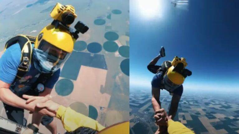 Dos paracaidistas logran entrelazar sus manos en pleno vuelo mientras practican skysurfing