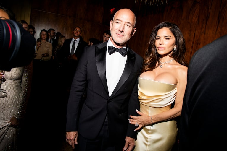 FILE -- Jeff Bezos and his wife, Lauren Sánchez Bezos, at a Kering Foundation gala in New York, Sept. 11, 2025. Bezos and Sánchez Bezos have been chosen as honorary chairs of the 2026 Met Gala, a position that often comes with a place in the receiving line and a position at the top of the steps at the Metropolitan Museum of Art. (Krista Schlueter/The New York Times)