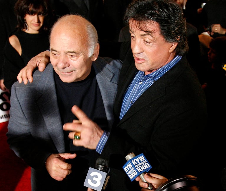 FILE PHOTO: Actor Sylvester Stallone (R) stands with co-star Burt Young before the premiere of the film "Rocky Balboa" in Philadelphia, Pennsylvania, December 18, 2006. REUTERS/Tim Shaffer/File Photo