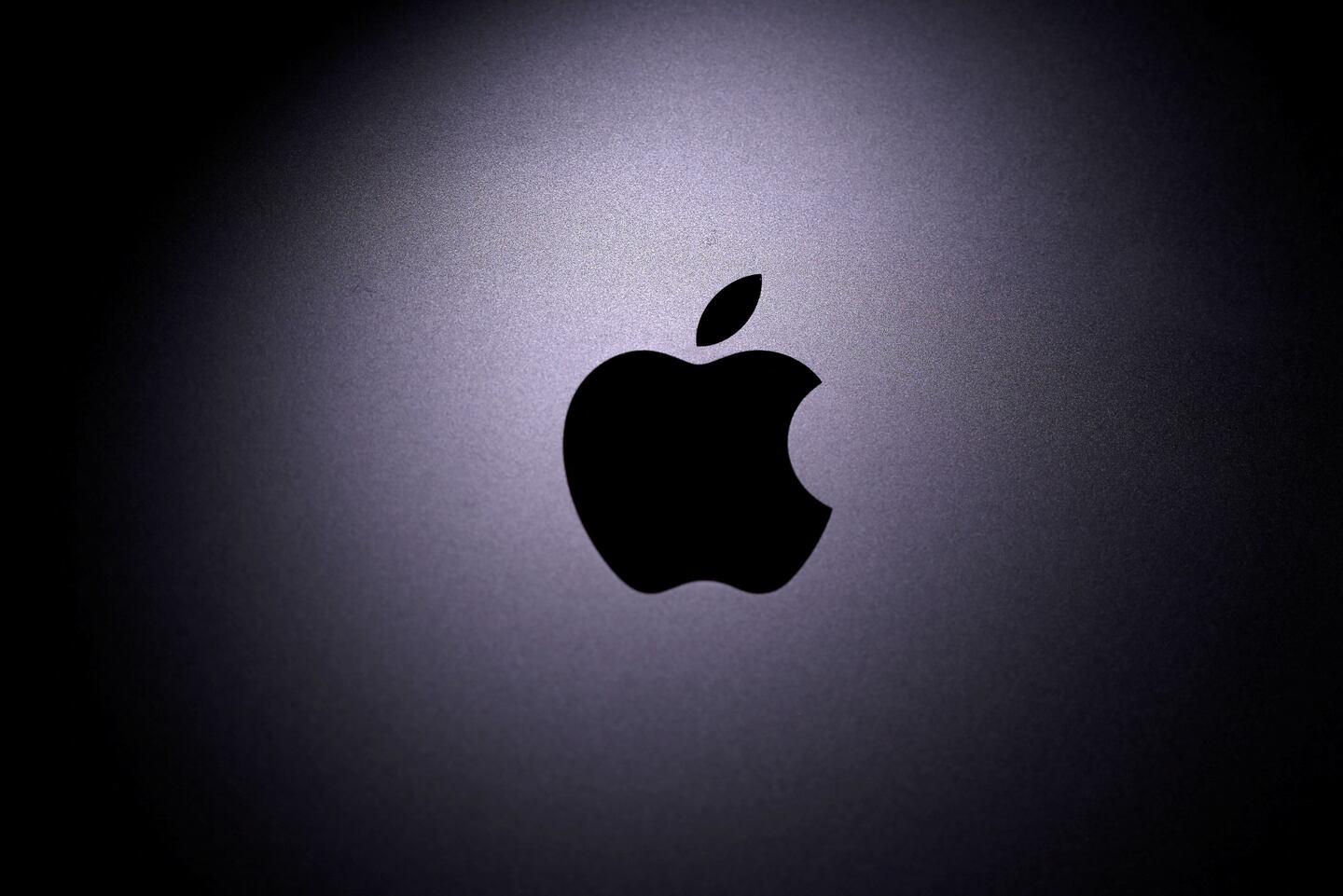 FILE PHOTO: Apple logo is seen on the MacBook in this illustration taken taken April 12, 2020. REUTERS/Dado Ruvic/Illustration/File Photo