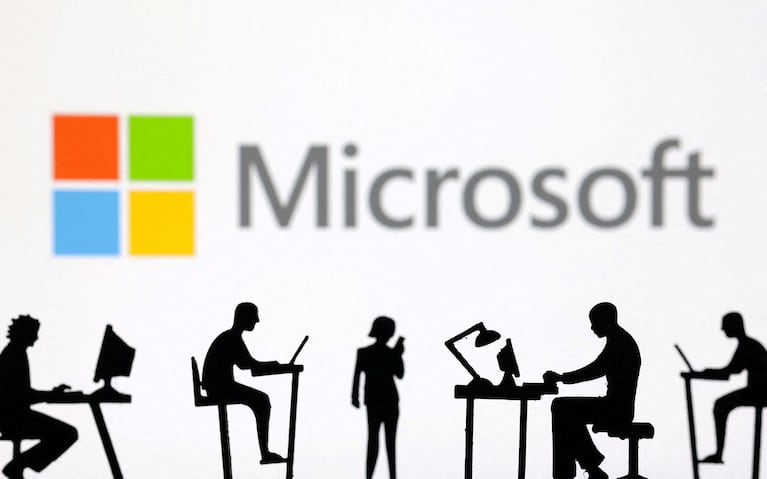 FILE PHOTO: Figurines with computers and smartphones are seen in front of Microsoft Corporation logo in this illustration taken, February 19, 2024. REUTERS/Dado Ruvic/Illustration/File Photo