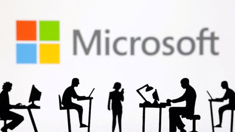 FILE PHOTO: Figurines with computers and smartphones are seen in front of Microsoft Corporation logo in this illustration taken, February 19, 2024. REUTERS/Dado Ruvic/Illustration/File Photo