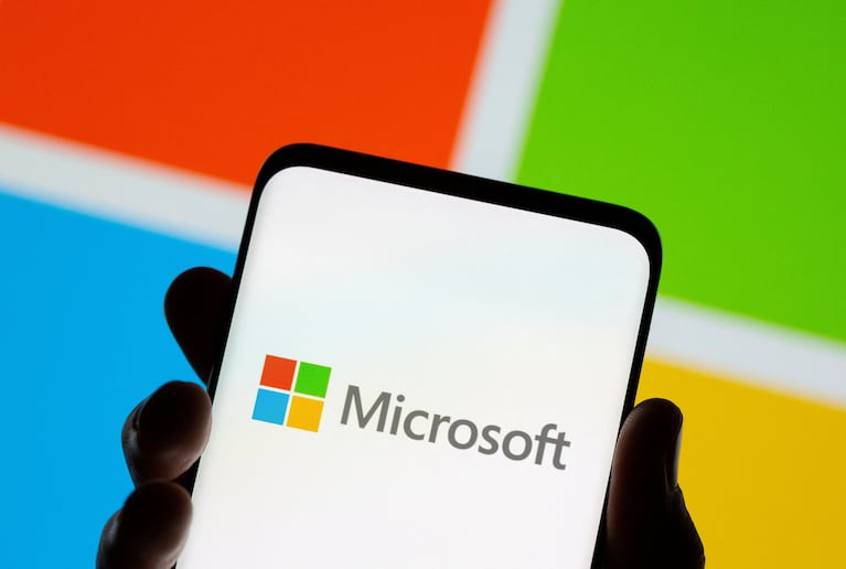 FILE PHOTO: Smartphone is seen in front of Microsoft logo displayed in this illustration taken July 26, 2021. REUTERS/Dado Ruvic/Illustration/File Photo