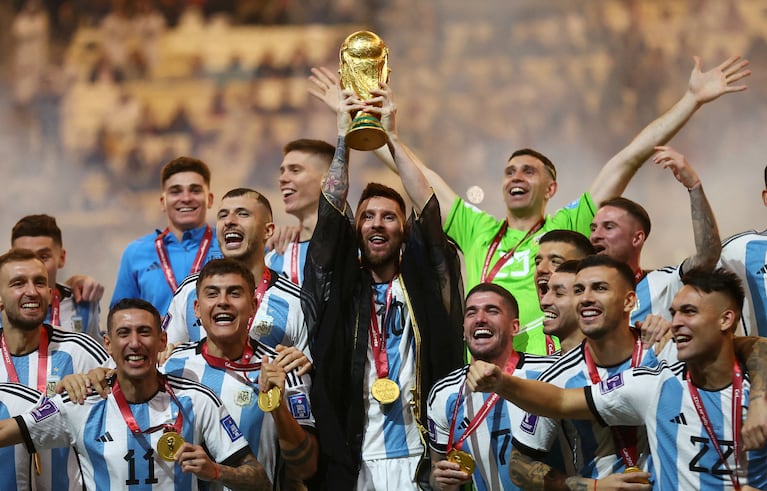 FILE PHOTO: Soccer Football - FIFA World Cup Qatar 2022 - Final - Argentina v France - Lusail Stadium, Lusail, Qatar - December 18, 2022 Argentina's Lionel Messi lifts the World Cup trophy alongside teammates as they celebrate winning the World Cup REUTERS/Carl Recine/File Photo
