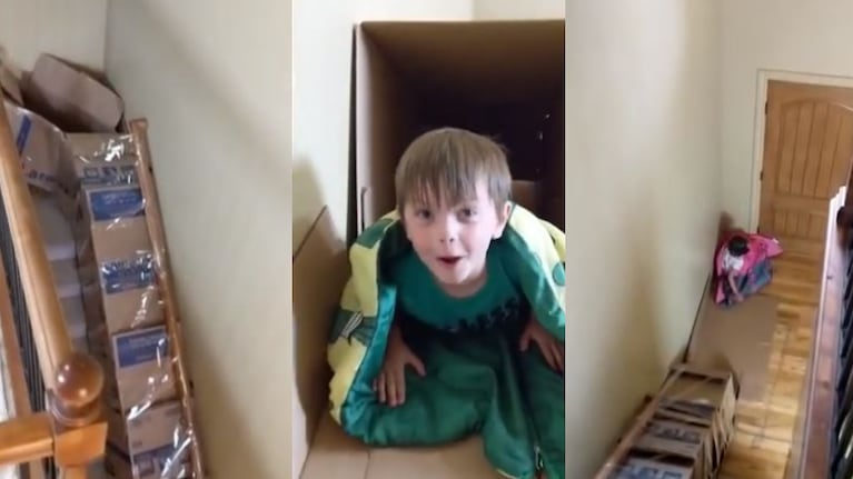 Pura diversión: un hombre construye un tobogán con cajas de cartón en las escaleras de su casa.