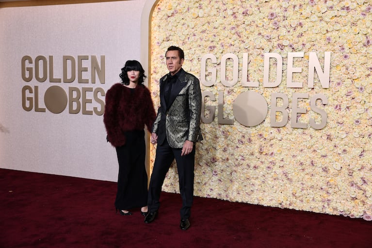 Riko Shibata and Nicolas Cage attend the 81st Annual Golden Globe Awards in Beverly Hills, California, U.S., January 7, 2024. REUTERS/Mike Blake