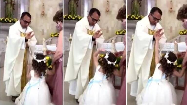 Sacerdote iba a darle la bendición a una niña, pero la reacción de ella es genial