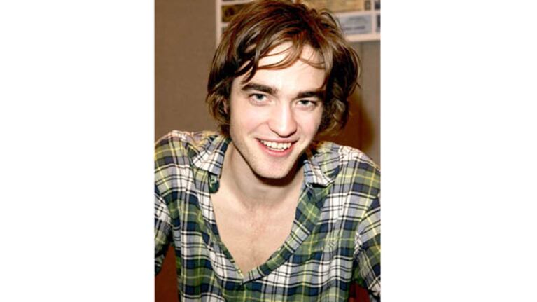 UNIMEDIA8979 - C01 - IMAGE9897913A - Stars signing autographs at Collectormania GMEX held at GMEX Exhibition Centre.- Robert Pattinson - Manchester, England - February, 11th 2006